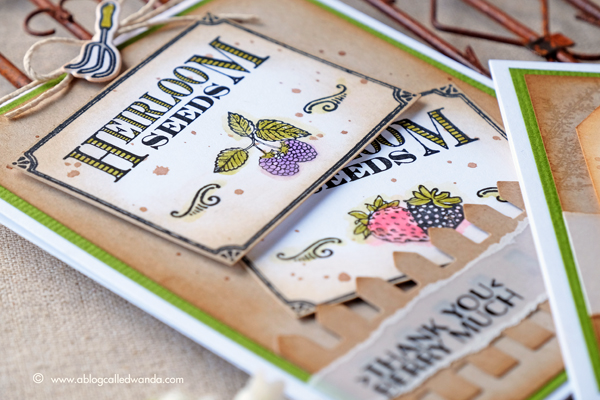 Hero Arts Monthly Card Kit garden theme. Seed packets and fence die. Colored with Kuretake Zig markers. Project by Wanda Guess
