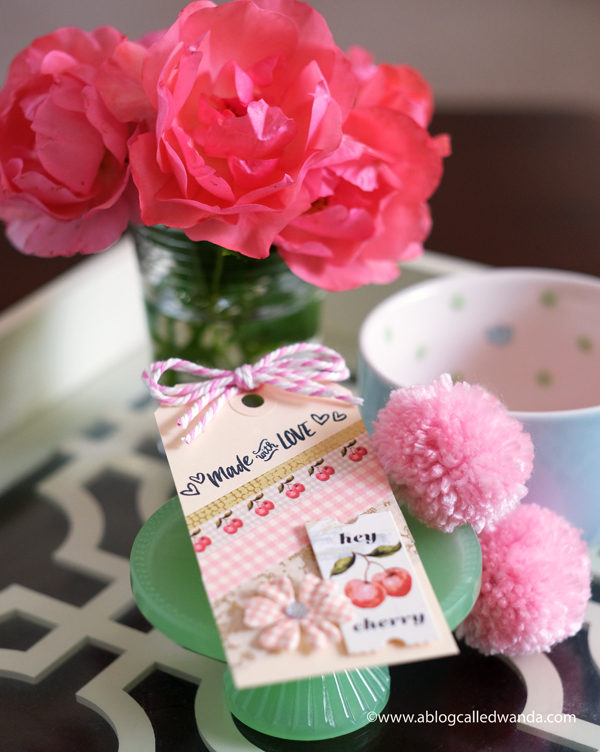 gift tag and pom poms