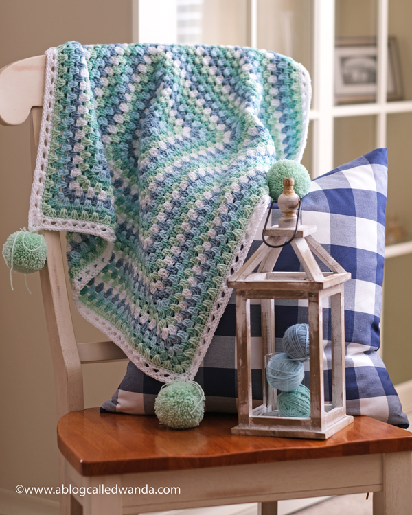Crochet Granny Square Blanket. Baby Blanket. Crochet ideas. Pastel colors. X border with pom poms. Wanda Guess