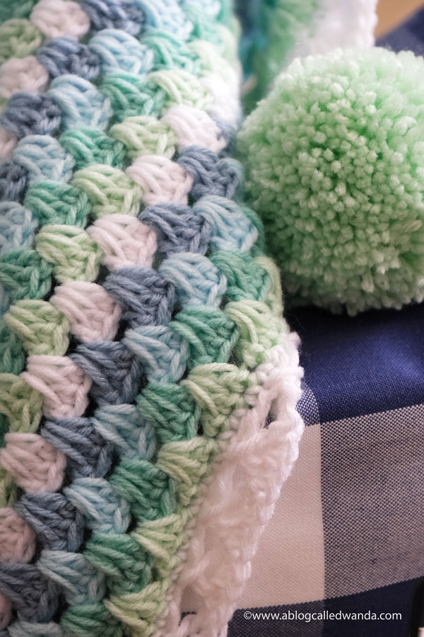Crochet Granny Square Blanket. Baby Blanket. Crochet ideas. Pastel colors. X border with pom poms. Wanda Guess