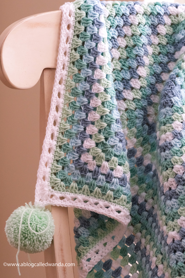 Crochet Granny Square Blanket. Baby Blanket. Crochet ideas. Pastel colors. X border with pom poms. Wanda Guess