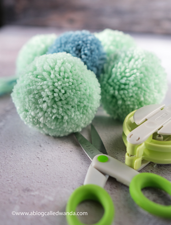 Crochet Granny Square Blanket. Baby Blanket. Crochet ideas. Pastel colors. X border with pom poms. Wanda Guess