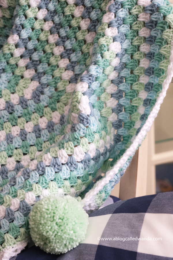 Crochet Granny Square Blanket. Baby Blanket. Crochet ideas. Pastel colors. X border with pom poms. Wanda Guess