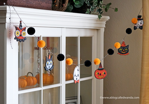 halloween decor, halloween decorations, tiered tray ideas, halloween fun, festive, decorations, party, garland, honeycomb balls, vintage halloween, wanda guess