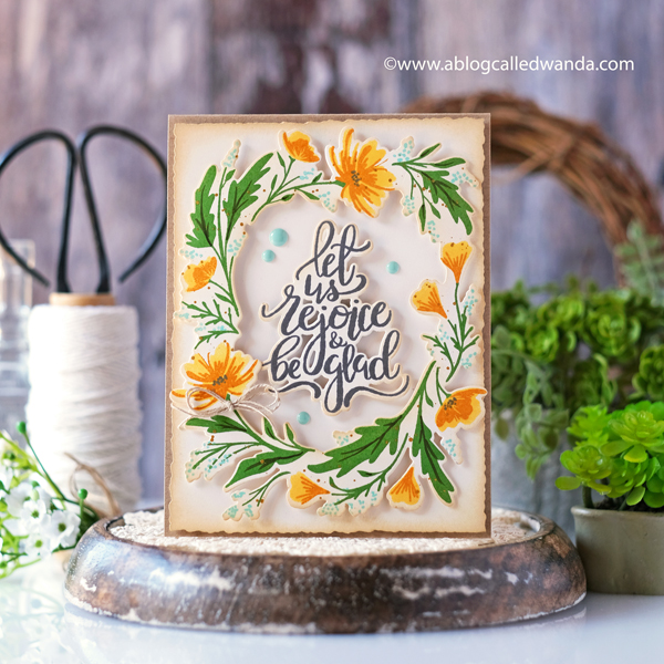 the greetery, the greetery new release, the greetery spring fever, the greetery easter, the greetery carrot die, the greetery bunny hop, the greetery wildflower mix dies, the greetery watering can, the greetery print shop, bow dies, watercolor, distress inks, empty grave stamp set, comforting commands, nordic circles, the greetery square dance dies and stencil, the greetery gingham, wanda guess, design team, a blog called wanda