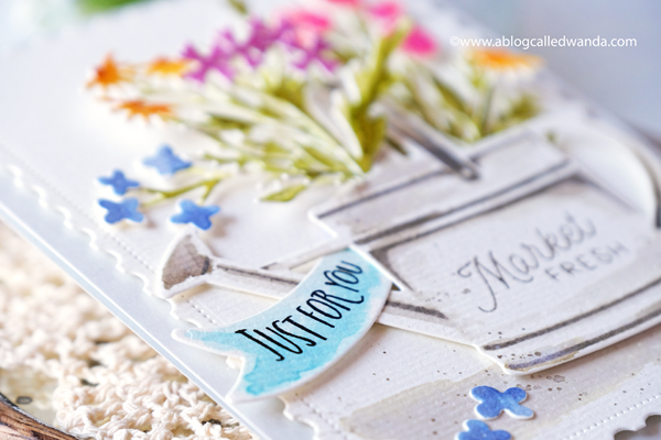 the greetery, the greetery new release, the greetery spring fever, the greetery easter, the greetery carrot die, the greetery bunny hop, the greetery wildflower mix dies, the greetery watering can, the greetery print shop, bow dies, watercolor, distress inks, empty grave stamp set, comforting commands, nordic circles, the greetery square dance dies and stencil, the greetery gingham, wanda guess, design team, a blog called wanda