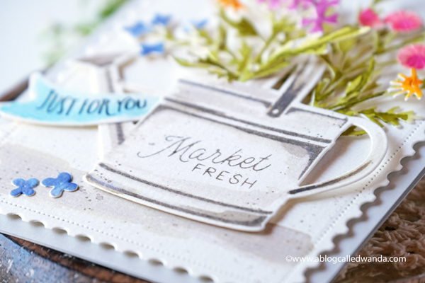 the greetery, the greetery new release, the greetery spring fever, the greetery easter, the greetery carrot die, the greetery bunny hop, the greetery wildflower mix dies, the greetery watering can, the greetery print shop, bow dies, watercolor, distress inks, empty grave stamp set, comforting commands, nordic circles, the greetery square dance dies and stencil, the greetery gingham, wanda guess, design team, a blog called wanda