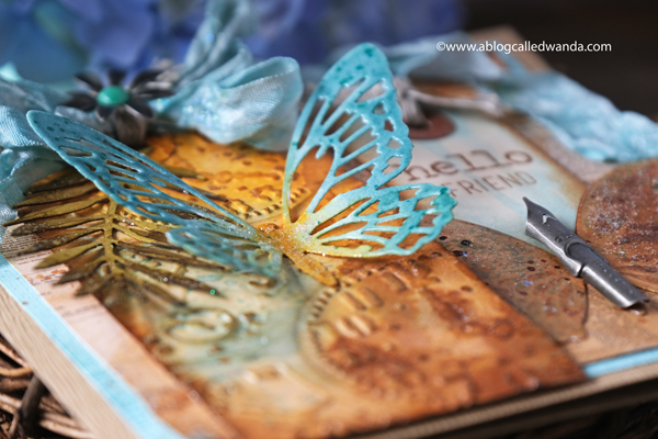 Tim Holtz, Sizzix, Ideaology, Stampers Anonymous, Speckled Egg Distress Ink, TIm Holtz Techniques. Butterfly card. Butterfly dies, Tropical Thinlets, Glorious Bouquet stamps. Distress Ink vintage card. Wanda Guess