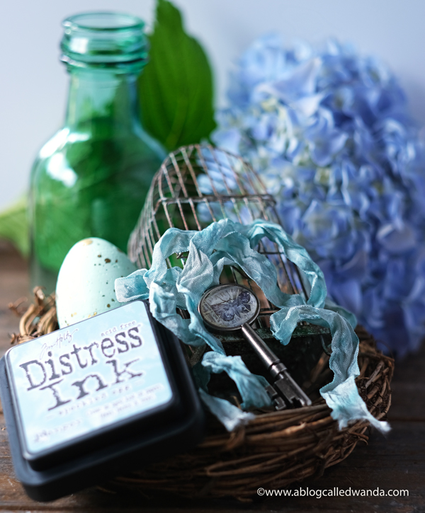 Tim Holtz, Sizzix, Ideaology, Stampers Anonymous, Speckled Egg Distress Ink, TIm Holtz Techniques. Butterfly card. Butterfly dies, Tropical Thinlets, Glorious Bouquet stamps. Distress Ink vintage card. Wanda Guess