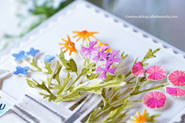 the greetery, the greetery new release, the greetery spring fever, the greetery easter, the greetery carrot die, the greetery bunny hop, the greetery wildflower mix dies, the greetery watering can, the greetery print shop, bow dies, watercolor, distress inks, empty grave stamp set, comforting commands, nordic circles, the greetery square dance dies and stencil, the greetery gingham, wanda guess, design team, a blog called wanda