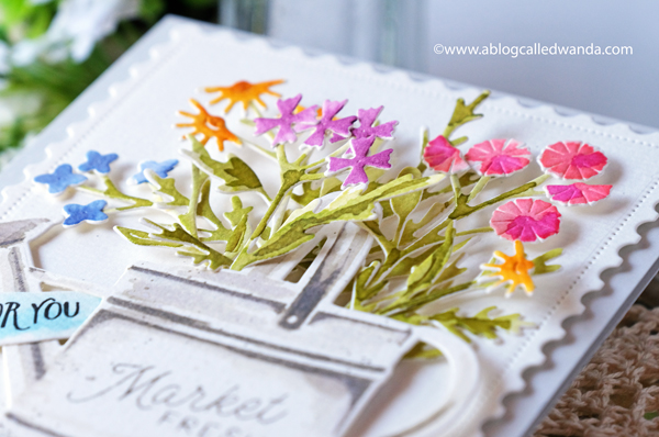 the greetery, the greetery new release, the greetery spring fever, the greetery easter, the greetery carrot die, the greetery bunny hop, the greetery wildflower mix dies, the greetery watering can, the greetery print shop, bow dies, watercolor, distress inks, empty grave stamp set, comforting commands, nordic circles, the greetery square dance dies and stencil, the greetery gingham, wanda guess, design team, a blog called wanda