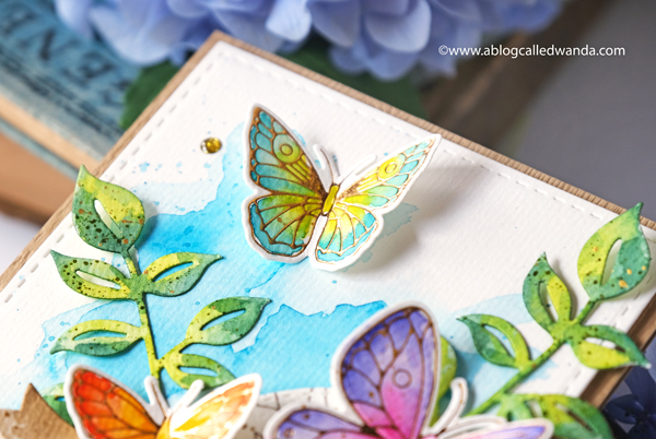 pinkfresh studio, pinkfresh studio blog hop, new release, blueberries and lemons, hot foil system, butterflies, vellum, watercolor, cards, card ideas, handmade cards, spellbinders hot foil system, mijello watercolors, leafy branch die, artistic bow die, wanda guess, a blog called wanda