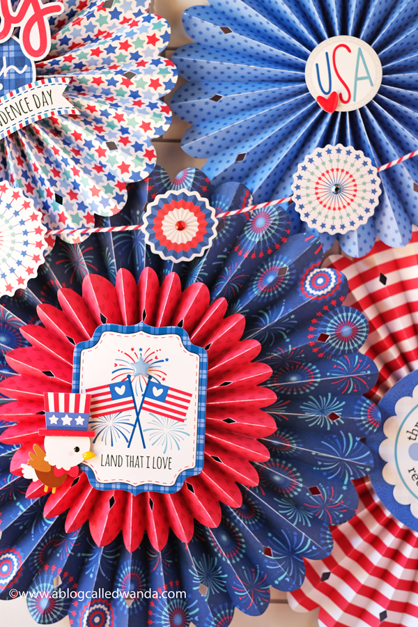doodlebug, doodlebug papers, doodlebug land that i love collection, patriotic crafts, red white and blue, 4th of july decorations, 4th of july crafts, rosettes, sizzix medallion die, brenda walton dies, patriotic party ideas, 4th of july decor, paper rosettes, paper medallions, wanda guess, a blog called wanda