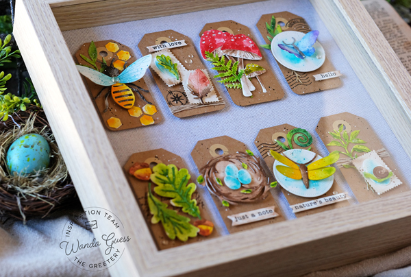 The greetery, the greetery stamps and dies, the greetery curio stamps and dies, the greetery botanical, flowers, dies, watercolor, shadow box, botanical shadow box, entomological shadow box, the greetery watercoloring, the greetery jumbo moth, the greetery toadstools, the greetery hone bees, the greetery mighty oak, the greetery pretty postmarks, art tags, artist trading cards, watercolor mijello mission gold, handmade, card ideas, the greetery ideas, wanda guess