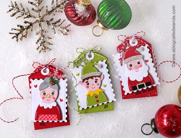 taylored expressions holiday squad, taylored expressions postage stamp stacklets, taylored expressions noel stamp and stencil, stencils, blender brushes, glitter paste, tags, christmas, holiday, elf, santa, mrs claus, make your own christmas tags, christmas cards, stencils with distress ink, blender brushes, classic christmas cards, card ideas, tag ideas, wanda guess, a blog called wanda