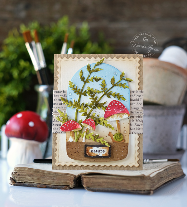 the greetery, the greetery blog, the greetery stamps and dies, the greetery toadstools, the greetery fern, the greetery arches, the greetery curio, watercolor, terrarium, cloche, mushrooms, handmade card, watercolor die cuts, vintage, distress ink, distress ink blending, the greetery design team, wanda guess, a blog called wanda