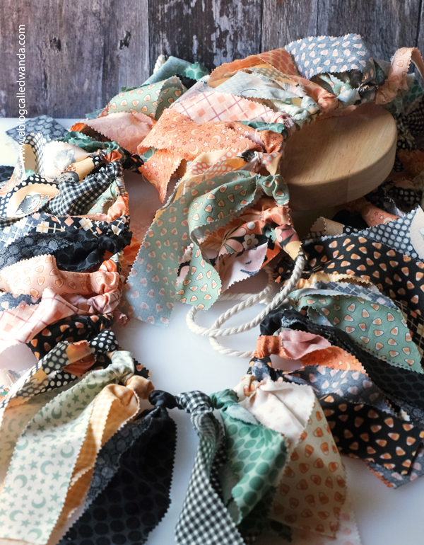 fabric garland, fabric strip garland, moda jelly roll, fabric ideas, home decor garland, make your own fabric garland, diy, gingham, 4th of july, halloween, shabby chic, wanda guess, a blog called wanda