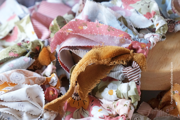 fabric garland, fabric strip garland, moda jelly roll, fabric ideas, home decor garland, make your own fabric garland, diy, gingham, 4th of july, halloween, shabby chic, wanda guess, a blog called wanda