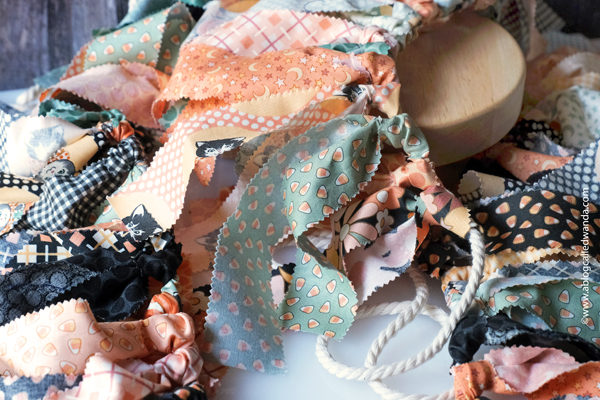 fabric garland, fabric strip garland, moda jelly roll, fabric ideas, home decor garland, make your own fabric garland, diy, gingham, 4th of july, halloween, shabby chic, wanda guess, a blog called wanda