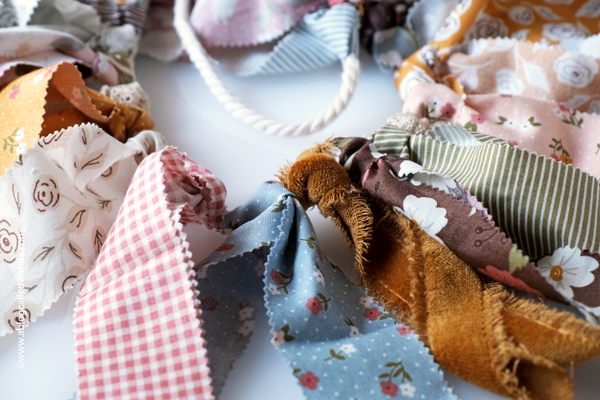 fabric garland, fabric strip garland, moda jelly roll, fabric ideas, home decor garland, make your own fabric garland, diy, gingham, 4th of july, halloween, shabby chic, wanda guess, a blog called wanda